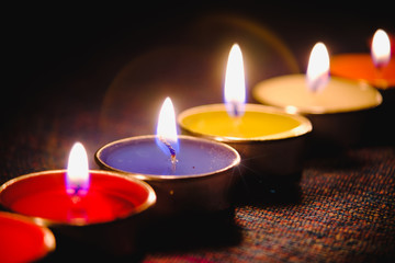 Selective focus of Candle flame light at night with night background.