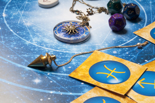  oracle esoteric concept with pendulum, zodiac signs, and astrology cubes, 