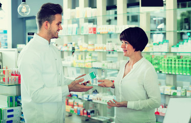 pharmacist helping customers