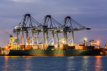 Soft focus , Containers loading by crane in the twilight , Trade