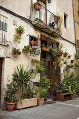 Old house in Barcelona, decorated with flowers