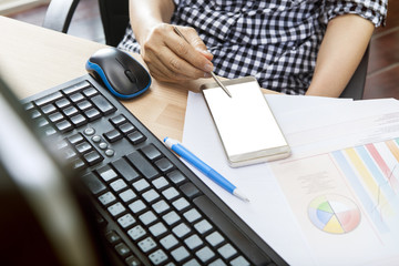 working woman using smart phone reading message on screen ,on of