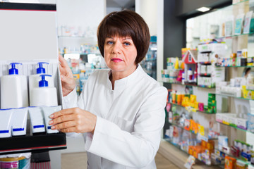 Portrait of  female druggist working in pharmacy