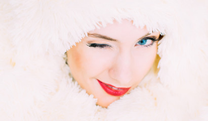 Portrait of young beautiful girl in retro style in fur, wink to the camera - 132513611