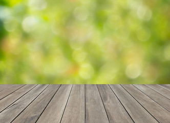 Wooden top table and green blurred bokeh background