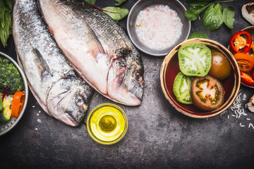 Raw Fish with vegetables, healthy food and diet cooking concept, top view