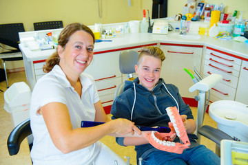 teenager at a female dentist's surgery
