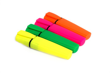 Four colored highlighters. Isolated on white background.