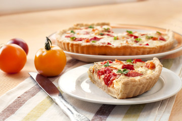 Tart with salted sheep cheese and tomatoes