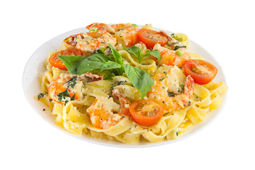 delicious fettuccine pasta with prawns on white plate