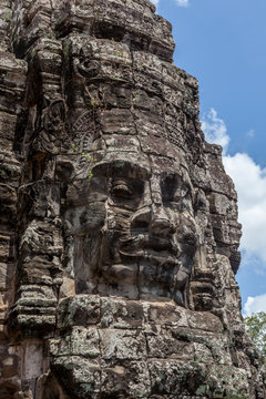 Ruin bayon stone face at gateway of Angkor Wat, Siem Reap, Cambo