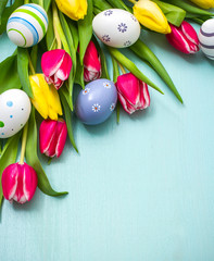 Tulips with colorful Easter eggs