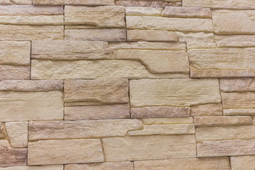 Brick background abstract textureweathered texture of stained old light brown stucco and painted red yellow wall in rural room Grungy rusty blocks stonework tech dark retro color architecture