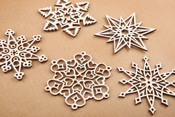 Laser cut wood snowflakes ornaments.  Wooden snowflakes on carton.