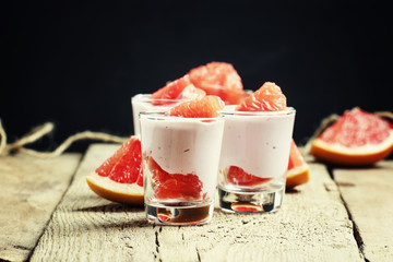 Cottage cheese mousse with cream and grapefruit, vintage wooden