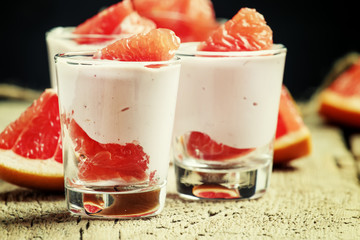 Cottage cheese mousse with cream and grapefruit, vintage wooden