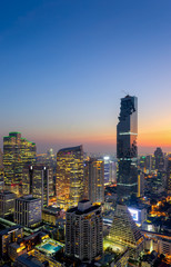 Top view of Bangkok modern office buildings, condominium in Bangkok city downtown with sunset sky ,Bangkok is the most populated city in Southeast Asia. Bangkok , Thailand - obrazy, fototapety, plakaty