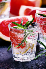 Citrus refreshing lemonade with rosemary and grapefruit, black b