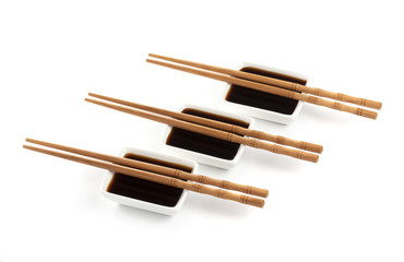 Soy sauce and chopsticks isolated on white background, with clipping path
