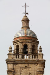 Detail of the bell tower of the Mayor church, in the town of Medina Sidonia, Spain