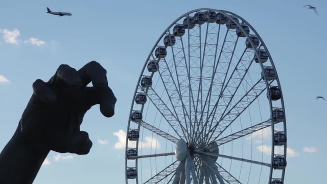 Hand sculpture and the Capital Wheel at the National Harbor in Washington DC
