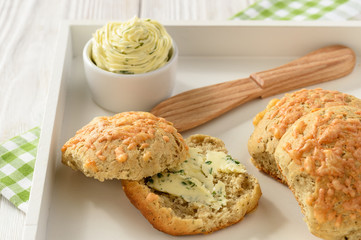 Homemade fresh wholegrain bread buns with cheese and garlic butter. 