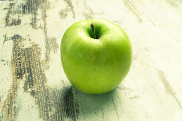 Health. Green apple with medical stethoscope