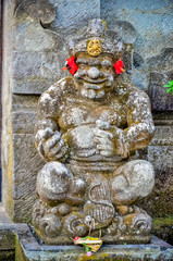 ancient god statues with smile at Bali