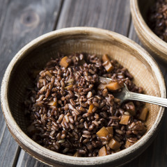 red rice in a clay plate. healthy diet. complex carbohydrates