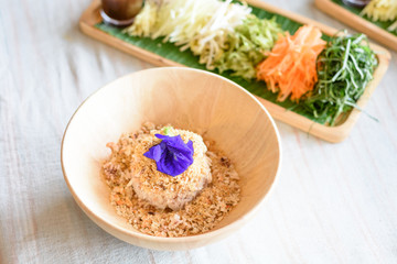 Rice salad set on wood plate, Khao yam, Thai cuisine