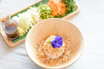 Rice salad set on wood plate, Khao yam, Thai cuisine