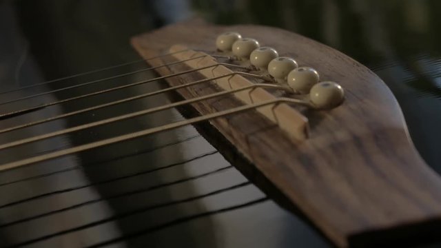 Bridge and saddle of an acoustic guitar