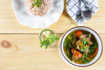 Soup with beef, vegetables, bone broth as base and boiled rice