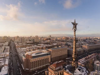 Deurstickers Aerial view of soviet star at the top of building and Kiev Central Department store on background at sunset time. Kiev, Ukraine. © dendidenko