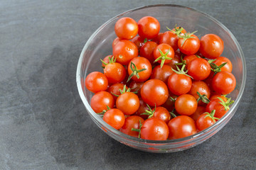Fototapeta na wymiar Fresh Cherry Tomato in the glass bowl 