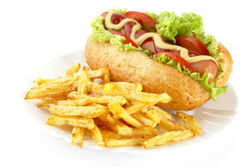 Hot dog with french fries on a plate on white