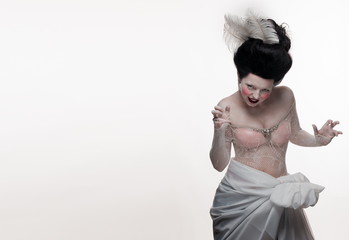 emotional actress brunette woman in the role of a vampire on a white background