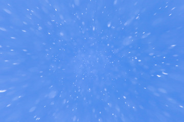 snowing on a blue sky