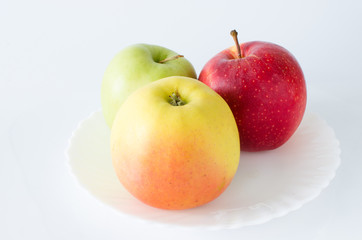 Three apples on a white background