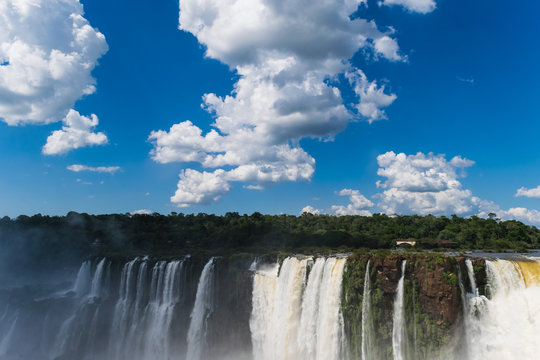 Panorama with impressing clouds of the Iguazu Waterfalls in Argentina and Brazil