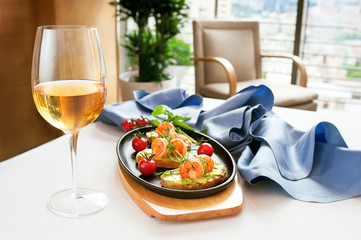 Bruschetta with stewed salmon, cucumber and sauce 