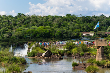 Crowded observation platform at the Iguazu Waterfalls in Argentina
