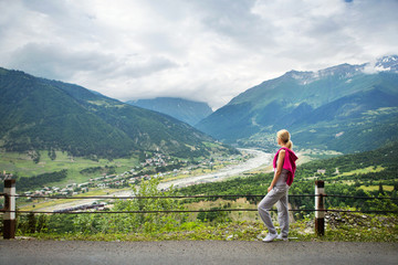 Fototapeta na wymiar Woman looking at mountain landscape. Rest while walking