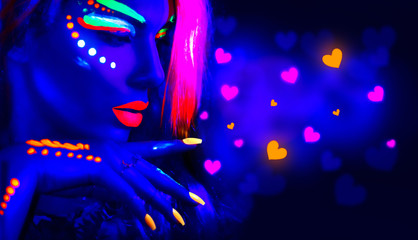 Valentine's day disco party. Fashion model girl in neon light, flying Valentine neon hearts