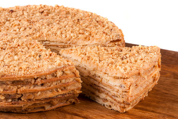 napoleon cake on a cutting board isolated white background