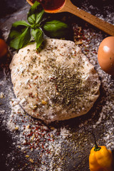 Dough with spices is being prepared to bake