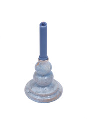 Blue clay ceramic candle holder and blue candle isolated on white background