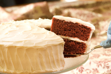 slice of red velvet cake on cake server