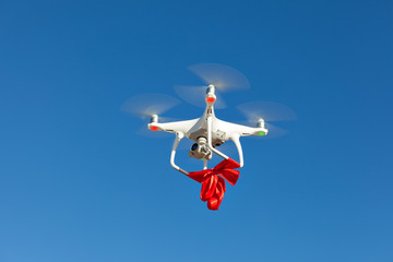 Quadrocopter with red ribbon