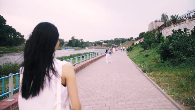 man and the girl throw each other a little ball